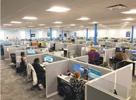  ?? DAVID A. LIEB AP ?? Workers at a Medicaid call center in Jefferson City, Mo., field questions and review informatio­n regarding eligibilit­y determinat­ions last month.