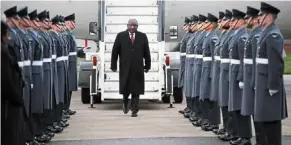  ?? — AFP ?? VIP arrival: ramaphosa being met by a british military guard of honour at stansted airport in London.