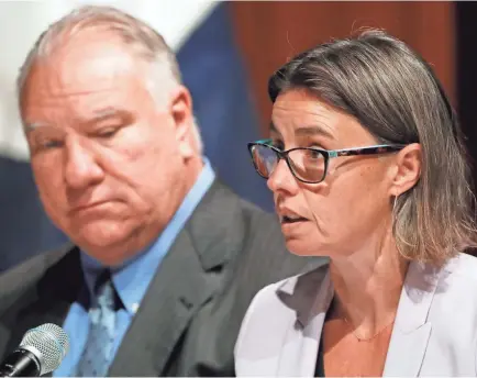  ??  ?? Jennifer Kelly, with the United Auto Workers, speaks in favor of auto tariffs during a Commerce Department hearing in Washington. At left is Clark Plucinski of the Certified Automotive Parts Associatio­n. JACQUELYN MARTIN/ AP