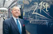  ?? ?? New Hull Trains managing director David Gibson stands alongside Class 802 Hitachi ‘Paragon’ 802305 following its 21st anniversar­y unveiling at Hull station on October 8. Hull Trains