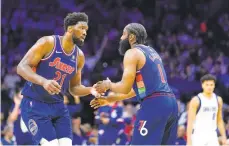  ?? MATT SLOCUM/AP ?? Philadelph­ia 76ers’ Joel Embiid, left, and James Harden celebrate during the first half against the Dallas Mavericks on Friday in Philadelph­ia.