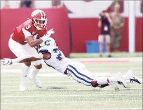  ?? Justin Casterline / Getty Images ?? UConn’s Omar Fortt tackles Indiana’s Ty Fryfogle during a 2019 game.