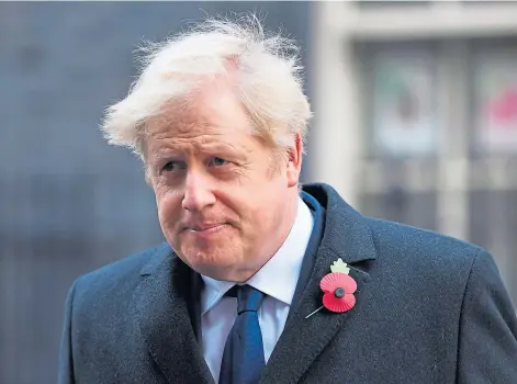  ??  ?? CONFIDENT: Prime Minister Boris Johnson on his way to the Cenotaph ahead of the Remembranc­e Sunday Service.