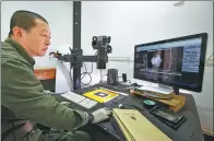  ??  ?? Left: A staff member from the Palace Museum in Beijing uploads the museum’s cultural relics to the system. Right: Staff members from the Potala Palace in Lhasa, capital of the Tibet autonomous region, sort out cultural relics.