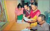  ?? PTI ?? Bodo women check their names in the final list of NRC at an a Seva Kendra in Baska district of Assam on Sept 2, 2019.