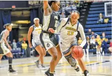  ?? STAFF PHOTO BY TIM BARBER ?? UTC’s NaKeia Burks tries to drive past Purdue’s Roxanne Makolo during Thursday’s game at McKenzie Arena.