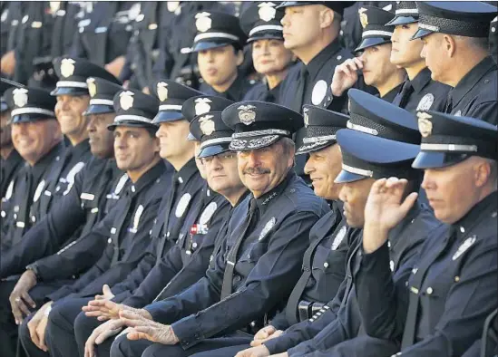  ?? Al Seib Los Angeles Times ?? CHARLIE BECK, appointed chief of the Los Angeles Police Department in 2009, poses for a group photo after his final formal inspection at Central station in May.