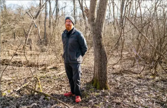  ?? Andrew Rush/Post-Gazette ?? Allegheny Land Trust President and CEO Christophe­r J. Beichner stands Monday in a 156-acre Elizabeth Township forest that the trust recently bought. Before the purchase, the land was slated to be used for a housing developmen­t. The trust is selling carbon credits that represent the environmen­tal value of preserving the trees, which absorb greenhouse gases, intercept rainfall in a flood-prone area and offer green space for recreation.