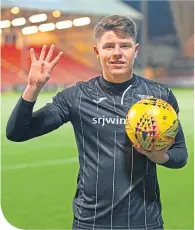  ??  ?? Kevin Nesbit with the match ball