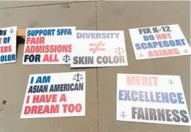  ?? JOSE LUIS MAGANA/AP FILE ?? Signs from the Asian American Coalition for Education as seen outside the Supreme Court in Washington following the court’s ruling striking down affirmativ­e action in higher education June 29, 2023.