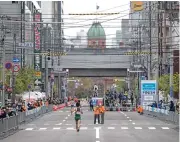  ??  ?? A file photo dated May 5, 2021 shows athletes during a half-marathon race which served as a test event for the 2020 Olympics in Sapporo, Japan