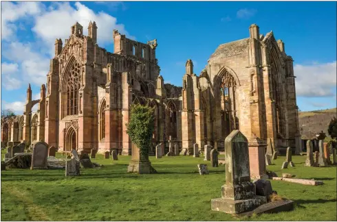  ??  ?? Above: The impressive ruins of Melrose Abbey. Below: Dunnottar Castle in Aberdeensh­ire and remote St Kilda