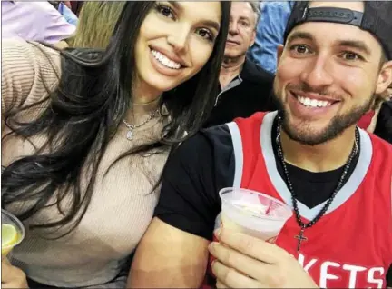  ?? STEVEN GRANT/GRANTFOTO.COM PHOTO ?? Kingston High graduate Charlise Castro and fiancé George Springer of the Houston Astros attend a recent NBA game in Houston.