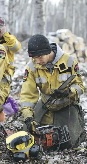  ??  ?? Shane Ominayak is one of the Lubicon band members trained in the FireSmart program, working with colleagues to clear out vegetation near Mihkowapik­waniy Cultural Preserve near Little Buffalo.