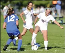  ?? STAN HUDY/THE SARATOGIAN ?? Burnt Hills-Ballston Lake’s Cassidy Karl looks to dribble out of trouble as Saratoga’s Autumn Soukup closes down on her Tuesday in Suburban Council action at Saratoga Springs High School.