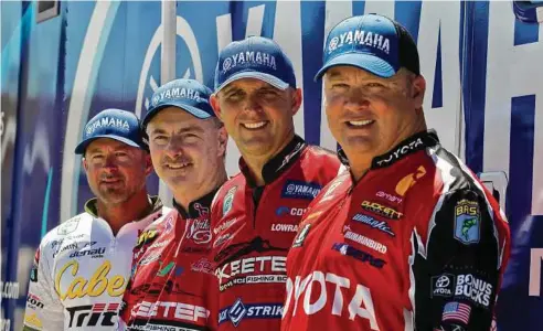  ?? Jason Fochtman / Houston Chronicle ?? Anglers Jeff Kriet, left, Mark Menendez, Marty Robinson and Terry Schroggins will compete along with 48 other profession­al bass fishers on Lake Conroe in the GEICO Bassmaster Classic Friday through Sunday.