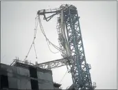  ?? Picture: REUTERS/ CARLOS BARRIA ?? GIANT TOPPLED: A collapsed constructi­on crane in downtown Miami as Hurricane Irma arrives in south Florida