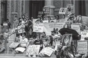  ?? Sam Owens/Staff photograph­er ?? Families of Robb Elementary School shooting victims sit on the steps of the state Capitol during a March for Our Lives rally in Austin last month.