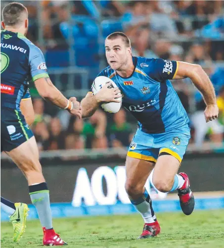  ?? Picture: NIGEL HALLETT ?? Ryan Simpkins takes on the Raiders defence in an NRL clash at Robina in 2017.
