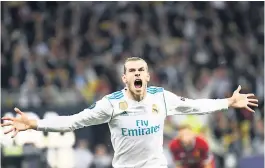  ??  ?? FESTEJO. Gareth Bale celebra su primera anotación en la gran final frente al Liverpool.