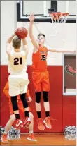  ??  ?? Senior Blackhawk Nick Coble (No. 21) scored the final basket sealing the win for the Blackhawks against the Gravette Lions Friday night in the last home game of the season.