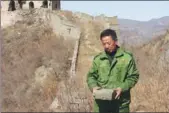  ??  ?? From left: Zhang Heshan at work during his daily patrol on the Great Wall. He has worn out more than 200 pairs of shoes during his patrols.