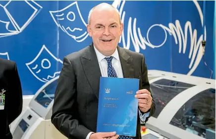  ?? PHOTO: MAARTEN HOLL/FAIRFAX NZ ?? Finance Minister Steven Joyce with the Budget as it rolls off the press in Petone yesterday.