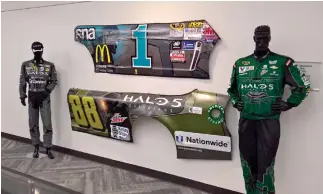  ??  ?? The Halo Museum, located within 343 Industries’ HQ, houses years’ worth of memorabili­a, dating back to the original Halo’s release in 2001. Among the exhibits: a battered piece of Dale Earnhardt Jr’s car from a Kansas Speedway NASCAR event in 2015