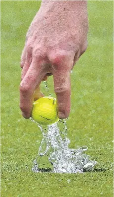  ?? PHOTO: GERARD O'BRIEN ?? Water hazard . . . Leith Campion retrieves his ball from the hole during a rainsoaked semifinal of the Otago Matchplay Championsh­ips held at Balmacewen yesterday.