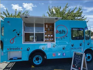  ?? SUBMITTED PHOTO ?? A Royersford woman has launched a new business that capitalize­s on America’s love of dogs and food trucks. Off The Leash Dog Truck is a mobile dog treat company — selling healthy, homemade treats made by two tri-county small businesses. In the lower left corner of the truck is a ‘treat chute,’ where pups can sample some of the treats.