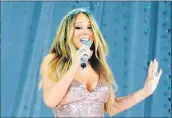  ?? AP FILE PHOTO ?? The former head of Mariah Carey’s security team claims the singer sexually harassed himand regularly called him a Nazi, a skinhead and a member of the KKK.