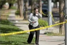  ?? Noah Berger/Associated Press ?? A woman leaves the scene of a shooting at a Santa Clara Valley Transporta­tion Authority facility Wednesday in San Jose, Calif. A Santa Clara County sheriff’s spokesman said the railyard shooting left nine people, including the shooter, dead.