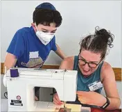  ?? COURTESY OF ROUGH DRAFT ATLANTA ?? At Congregati­on Shearith Israel in Morningsid­e, kids and adults made comfort bags, meals and dog beds with personal touches for the Day of Service.