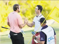  ?? Michael Reaves / Getty Images ?? Billy Horschel (right) shakes hands with Scottie Scheffler after winning 2 and 1 in the final round of the WGC Match Play.