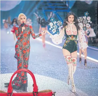  ??  ?? Above Lady Gaga and Sui He at the Victoria’s Secret Fashion Show, at the Grand Palais in Paris, last November.