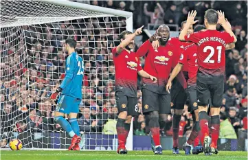  ??  ?? Long time coming: Romelu Lukaku (second from left) celebrates scoring United’s third goal and his first at Old Trafford since March