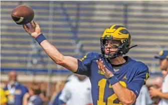  ?? TONY DING/AP ?? Cade McNamara offers Michigan some real promise at quarterbac­k.