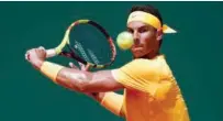  ?? Reuters ?? Rafael Nadal returns to Grigor Dimitrov (unseen) during their semi-final match of Monte Carlo Masters in Monaco on Saturday.