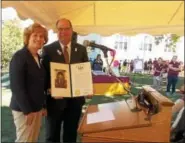  ?? LISA MITCHELL - DIGITAL FIRST MEDIA ?? Sen. Juday Schwank presents a citation to Kutztown University President Dr. Kenneth Hawkinson during the 150th birthday party on Sept. 15.