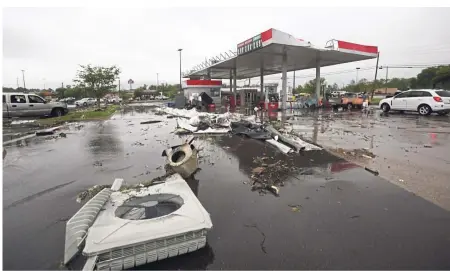  ?? — AP ?? Closed: A damaged fuel station following the severe weather in Vicksburg, Mississipp­i, where authoritie­s said a possible tornado touched down.