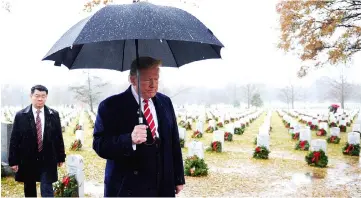  ??  ?? Trump visits Section 60 in Arlington Cemetery in Arlington. — Reuters photo