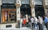  ?? MURAD SEZER / REUTERS ?? Tourists line up to enter a Louis Vuitton store in Istanbul on Monday.