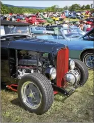  ?? CARL HESS - DIGITAL FIRST MEDIA ?? Knowing this would be the final event at this location, more than 500 vehicles turned out for the 20th annual Kauufman’s Antique and Custom Cruise-In on Labor Day. That slick black 1932 Ford Roadster belongs to Greg Miller of Blandon.