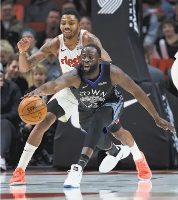  ?? Craig Mitchelldy­er / Associated Press 2019 ?? Kent Bazemore ( rear) didn’t play his best when he was in Portland for a 43game stretch, shooting 34.7% from the field, but now he’s back to help Draymond Green and the Warriors.