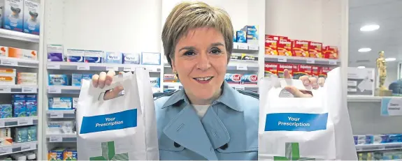  ?? Picture: PA. ?? First Minister Nicola Sturgeon visits a chemist in Falkirk.