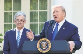  ?? William Moon / Abaca Press ?? President Trump announces that Jerome Powell ( left) is his Fed nominee.