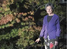  ?? PITTSBURGH POST-GAZETTE ?? Ina Block poses for a portrait by a ‘Bloodgood’ Japanese maple in her Mt. Lebanon garden.