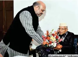  ??  ?? BJP President Amit Shah with ND Tiwari