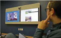  ?? AP ?? Jeff Wieland, Facebook director of accessibil­ity, watches as engineer Matt King, who is blind, demonstrat­es facial recognitio­n technology via a teleconfer­ence at Facebook headquarte­rs in Menlo Park, California. —