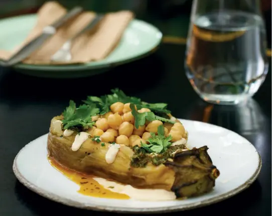  ??  ?? CHARRED EGGPLANT by Shannon Binnie, The Botanic This popular gluten-free dish from the restaurant’s selectiion of vegan dishes features organic Australian eggplant served with tahini, chickpeas, chermoula and soft herbs.